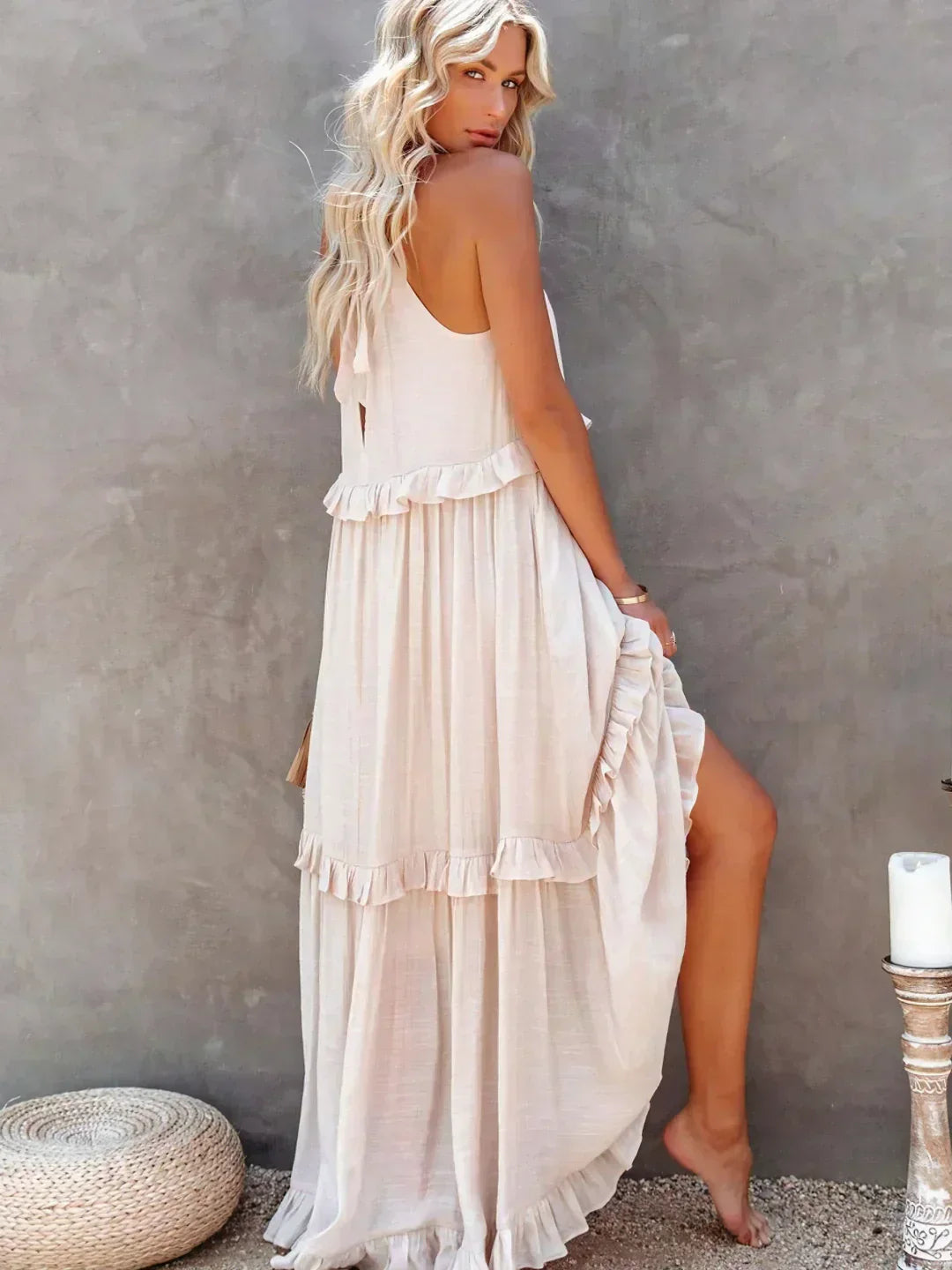 Chic blue flowy halterneck maxi dress, ruffles & pockets for an elegant summer look.