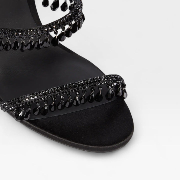 Stylish women's stiletto sandals with glittering crystal straps for formal evening wear.