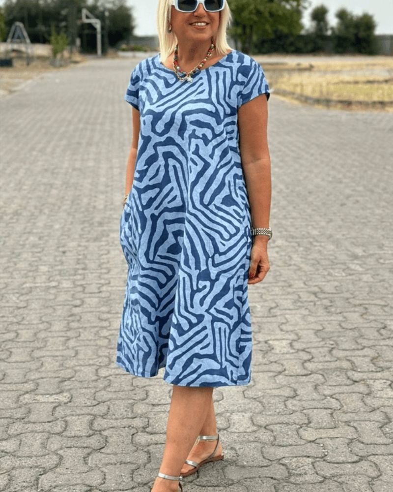 White women's round neck summer dress. Knee-length casual elegance, comfortable for everyday wear.
