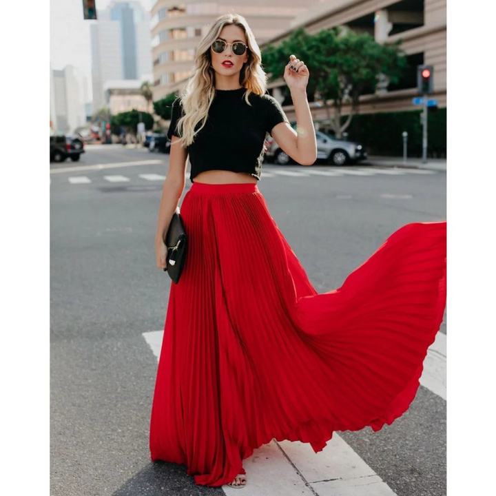 Chic women's long pleated midi skirt, high-waisted and elegant, ideal for any fashion ensemble.