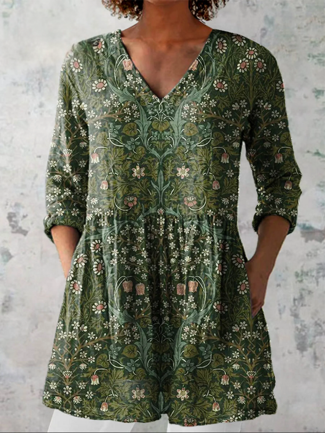 Women's flowy green V-neck long-sleeve blouse, comfortable & versatile for casual or elegant everyday wear.
