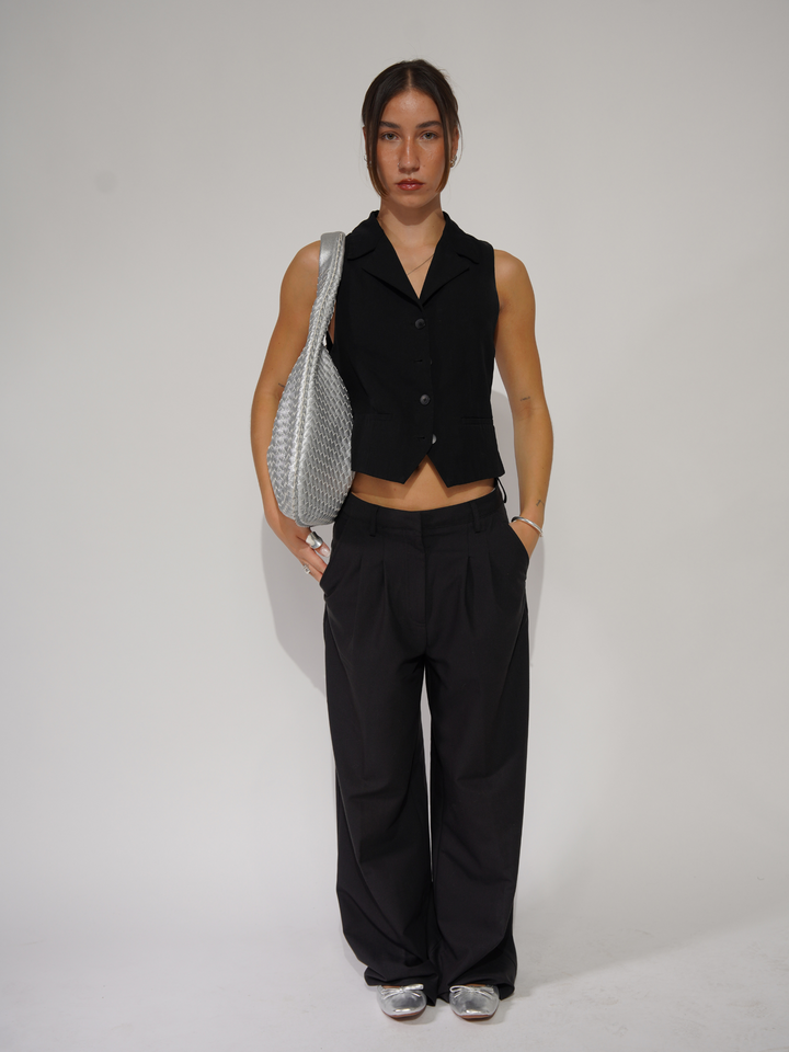 Modern women's crossbody shoulder bag. Sleek vegan leather handbag for daily use.