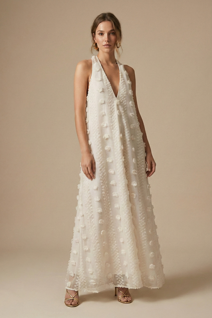 Elegant women's halter backless maxi dress with delicate 3D floral appliqué, perfect for summer evenings & resorts.