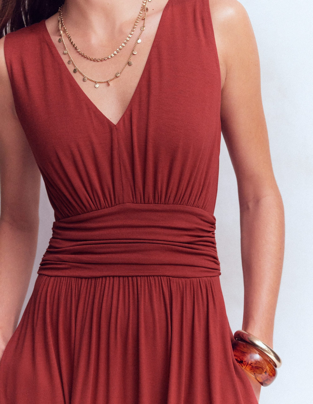 Women's rich chestnut draped maxi dress, featuring a stylish v-neck and flowy babydoll silhouette.