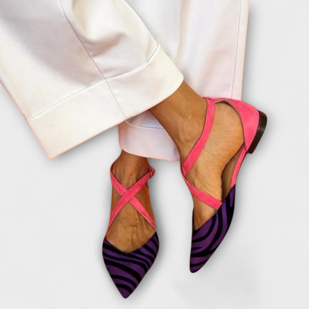 Fashionable women's slip-on loafers with elegant band detail. Chic flat shoes for comfortable everyday style.