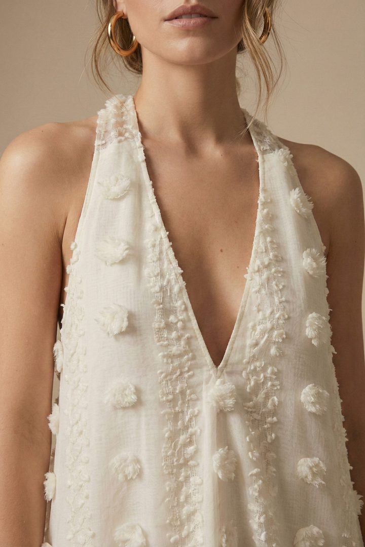 Stunning backless halter maxi dress for women, featuring 3D floral details and a flowing silhouette, ideal for events.