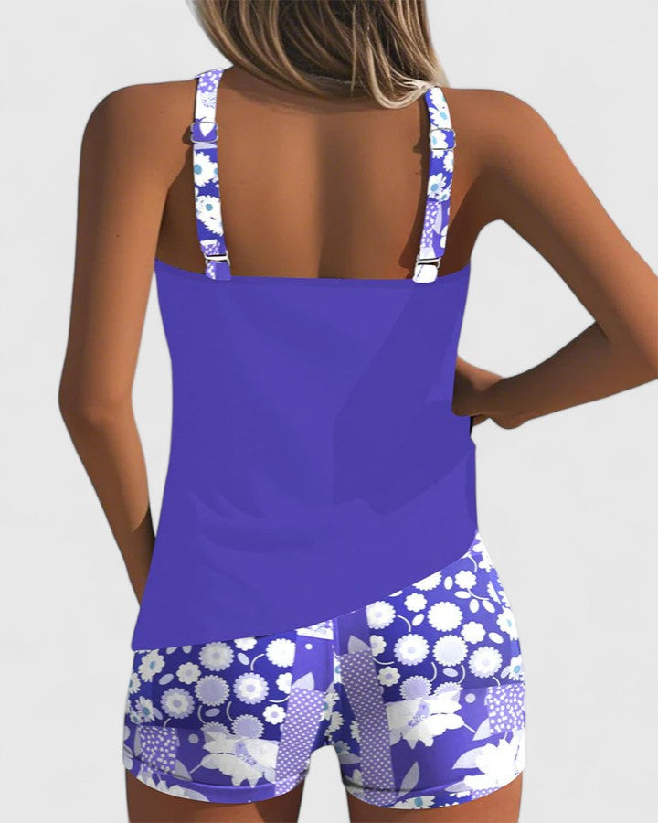 Vibrant floral women's tankini swimsuit, a comfortable and flattering choice for resort wear.