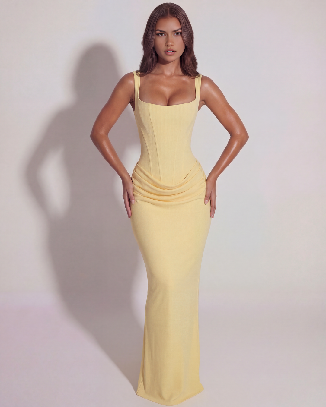 Elegant butter yellow sleeveless gown for women, perfect for a chic formal event.