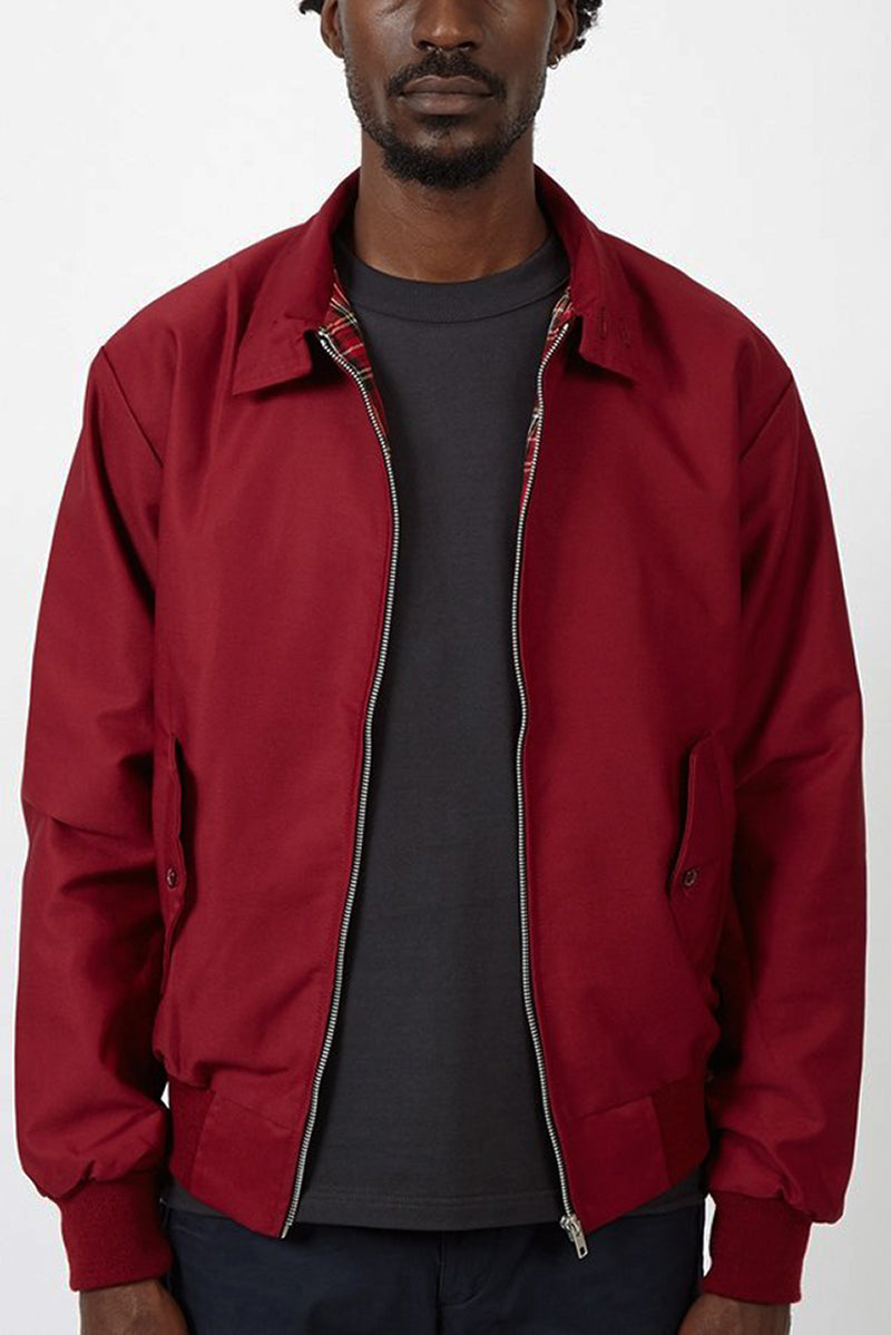 Detailed shot of a men's plaid Harrington jacket zipper, showcasing quality.