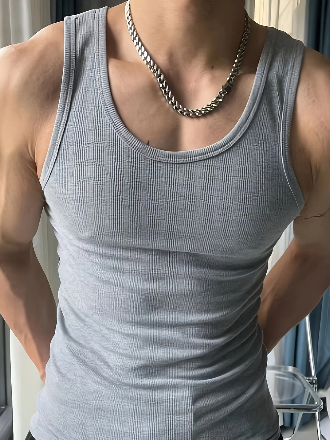 Men's athletic workout tank top, lightweight & breathable for peak performance.