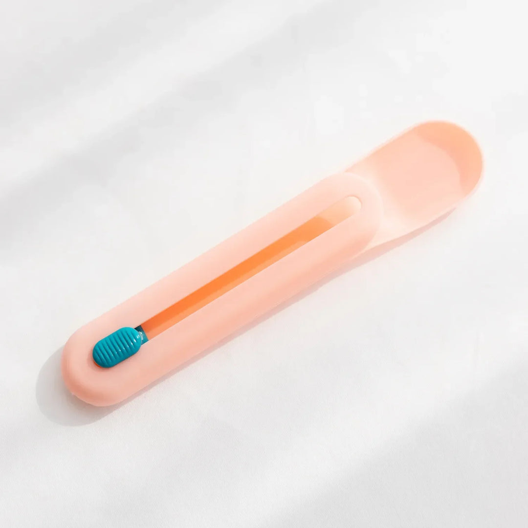 Versatile pet feeding spoon acting as a tube squeezer for efficient and complete wet food dispensing.