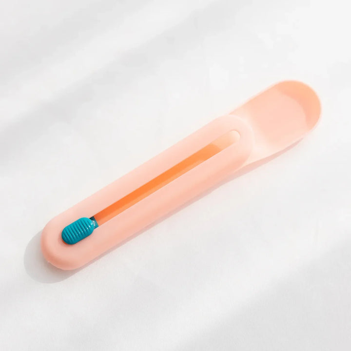 Versatile pet feeding spoon acting as a tube squeezer for efficient and complete wet food dispensing.