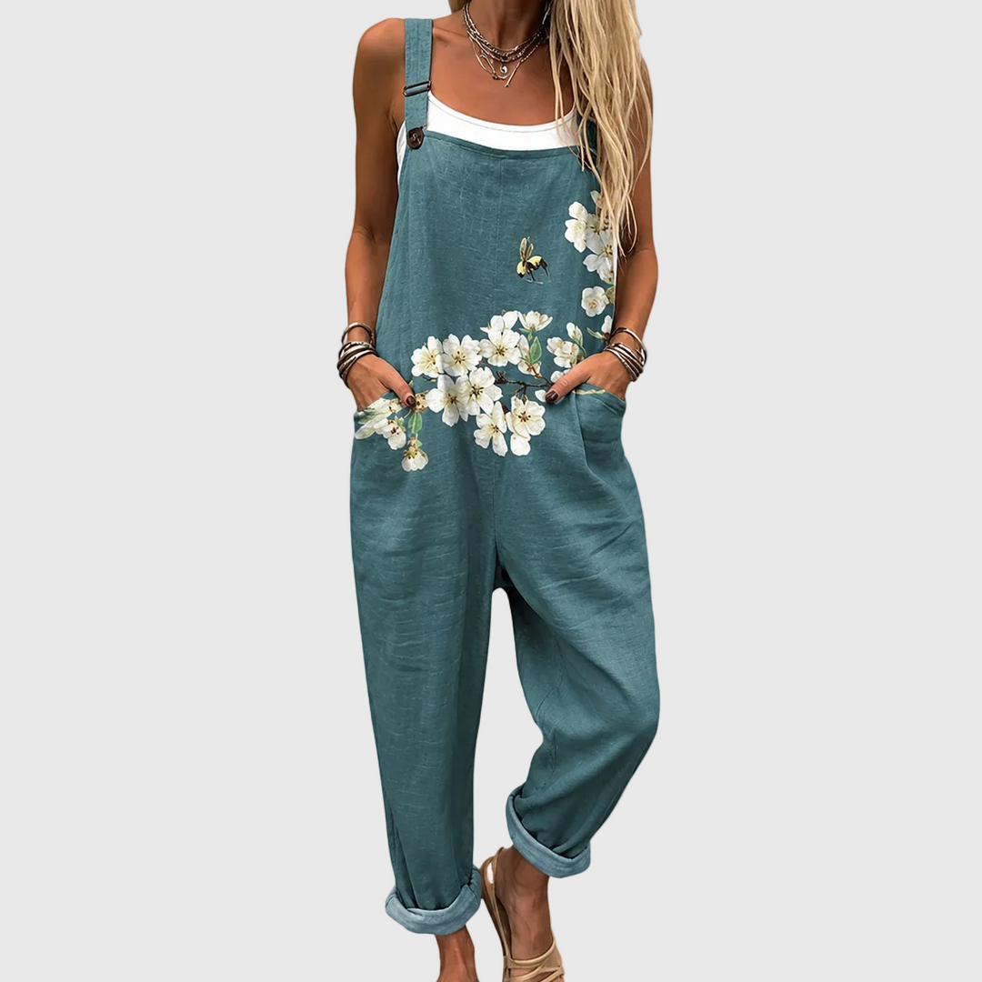 Women's petrol green floral relaxed fit garden jumpsuit, sleeveless & loose for comfortable summer casual wear.