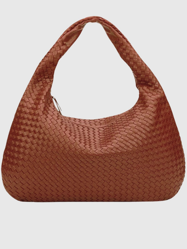 Versatile one shoulder vegan leather bag. Stylish women's crossbody accessory.