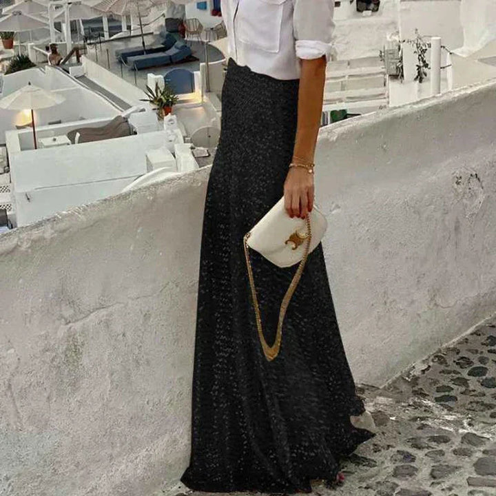 Chic women's black sequin maxi skirt with elastic waist. Ideal for glamorous parties, evening fashion & streetwear.