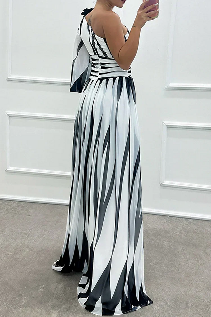 Formal women's striped one-shoulder maxi dress with a stylish leg slit. Perfect for special evening occasions.