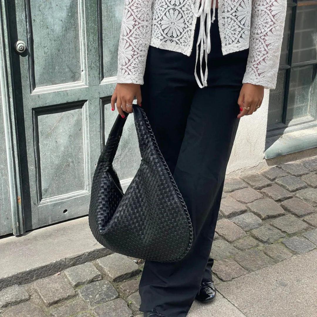 Everyday women's woven shoulder bag, soft vegan leather, practical & chic accessory.