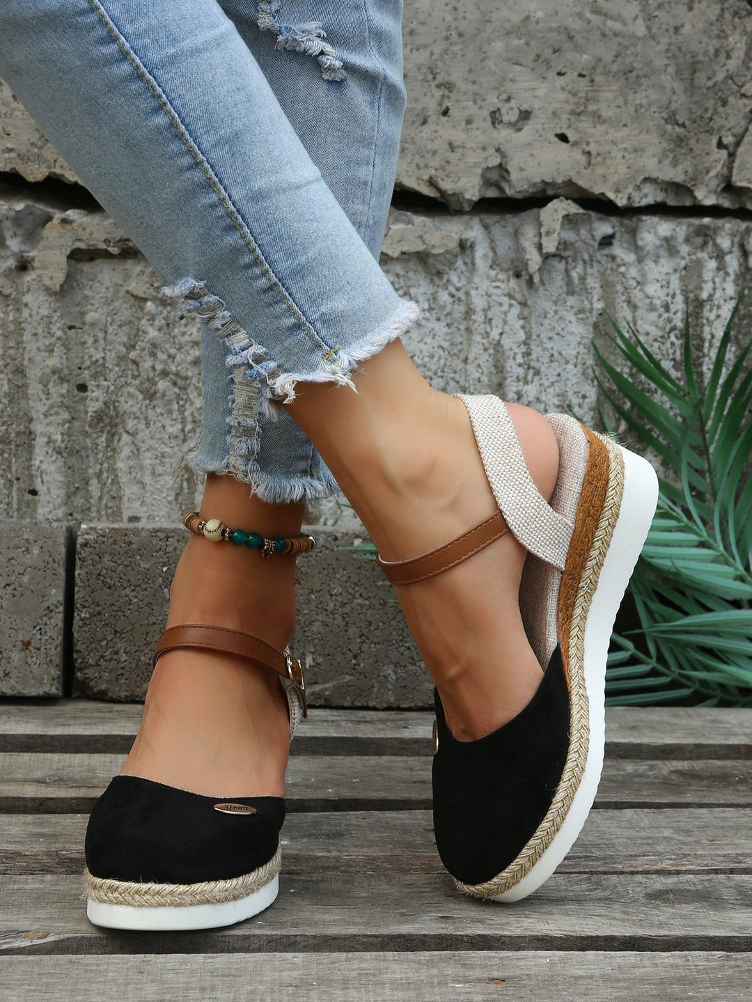 Comfortable women's slip-on sandals featuring orthopedic design, cushioned support & stylish woven straps.
