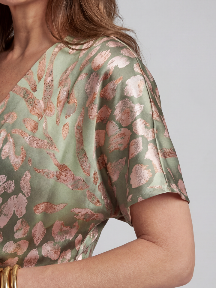 Versatile women's short sleeve midi dress with modern abstract print & chic twist waist. Perfect day-to-evening style.