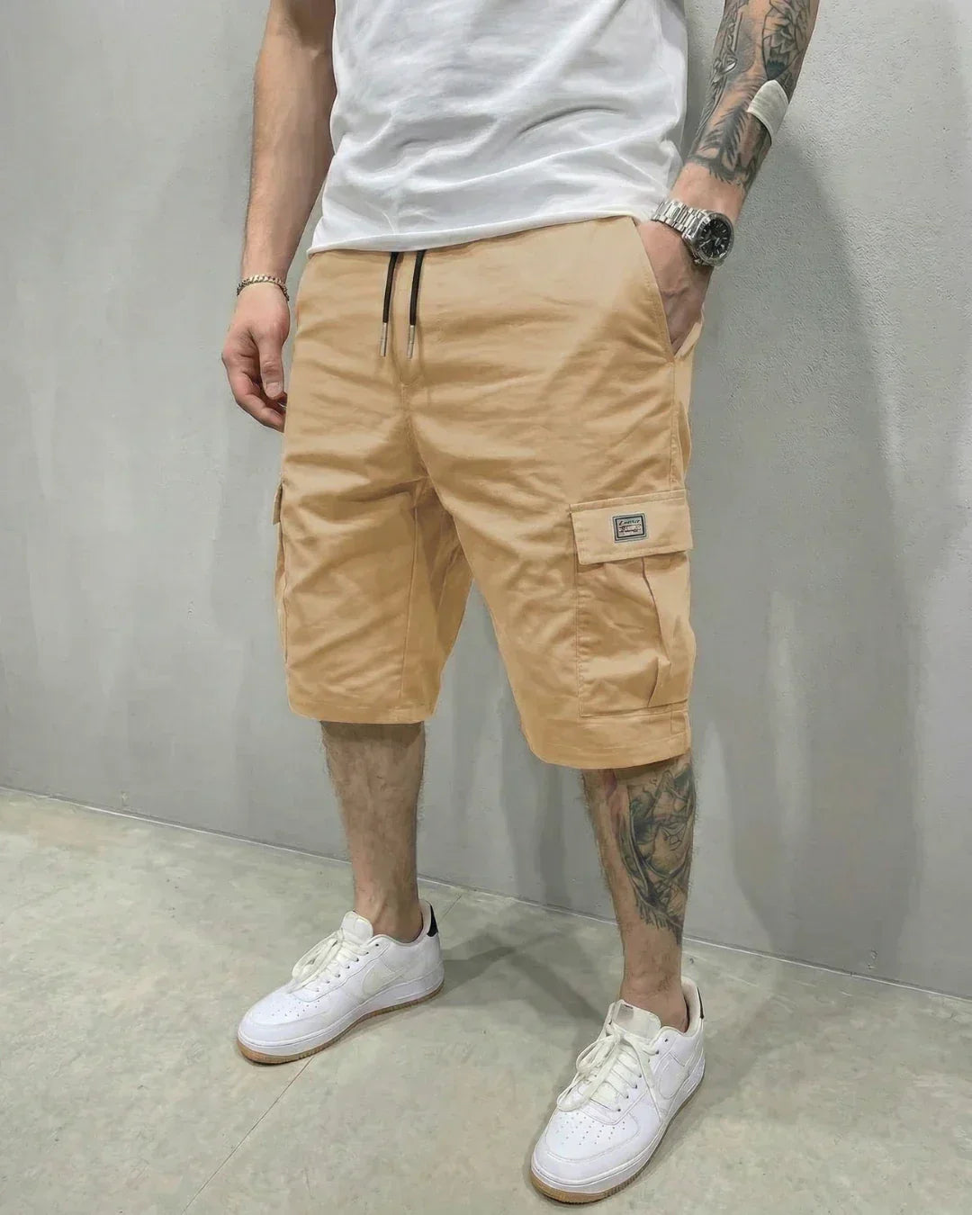 Stylish men's casual cargo shorts featuring a comfortable drawstring waist, relaxed fit, & multiple flap pockets.