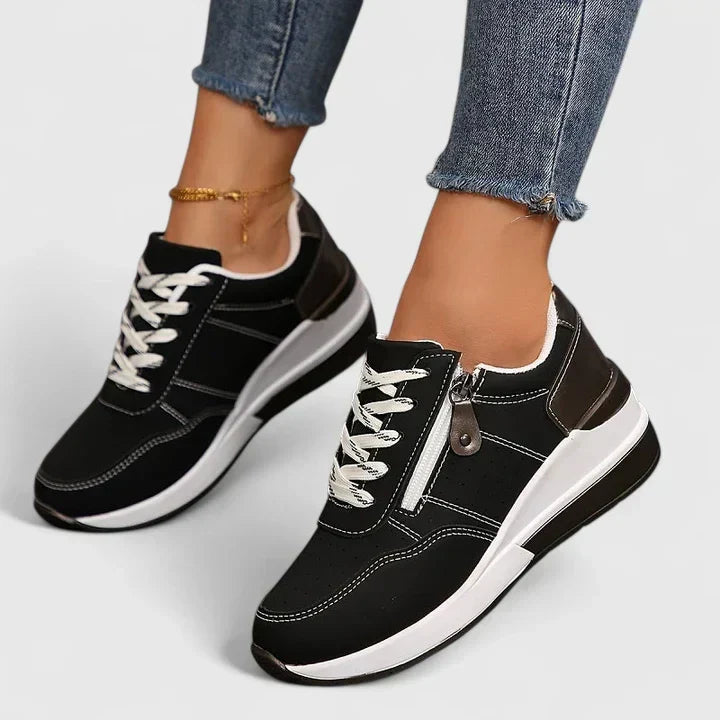 Supportive women's sneakers featuring a wide toe box & ergonomic design for daily comfort and healthy feet.