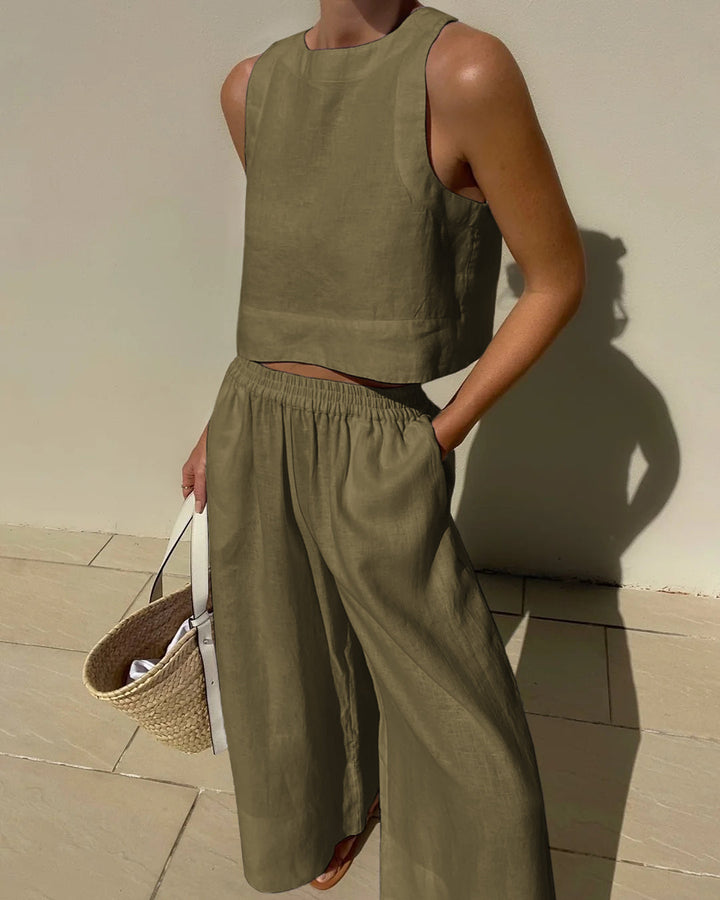 Matching women's coordinated two-piece set with a trendy crop top and elegant wide-leg pants for effortless style.