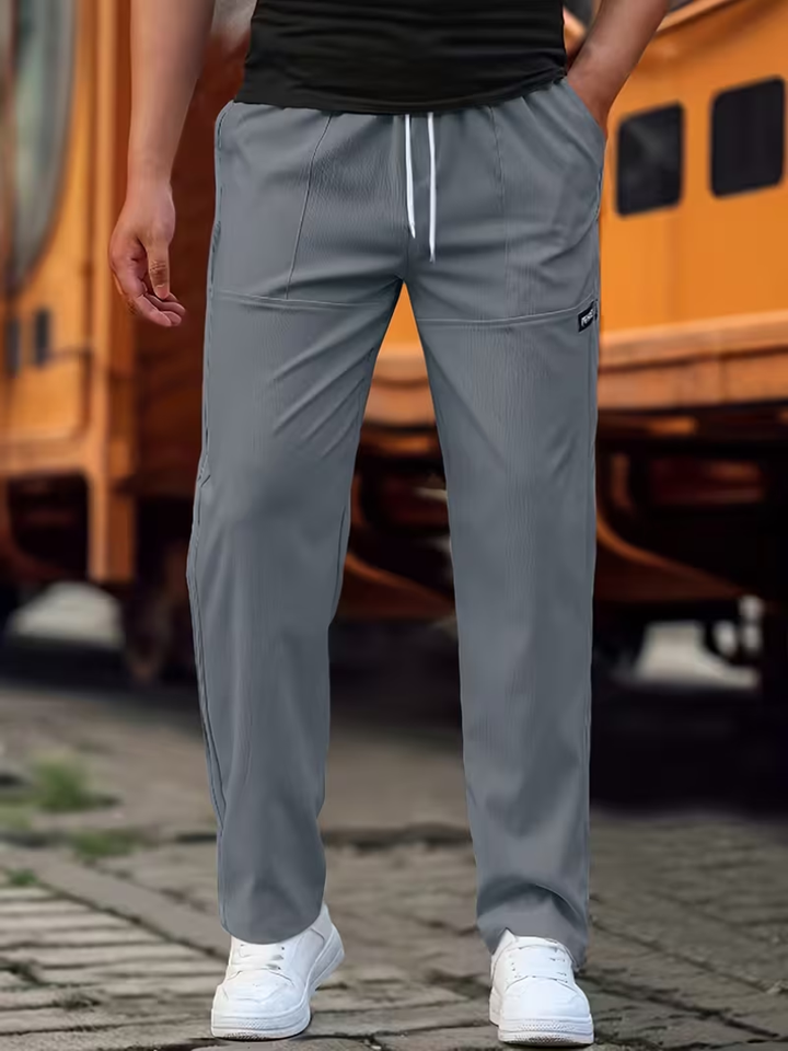 Classic men's straight-leg trousers, perfect for smart casual or everyday wear. Comfortable & versatile.