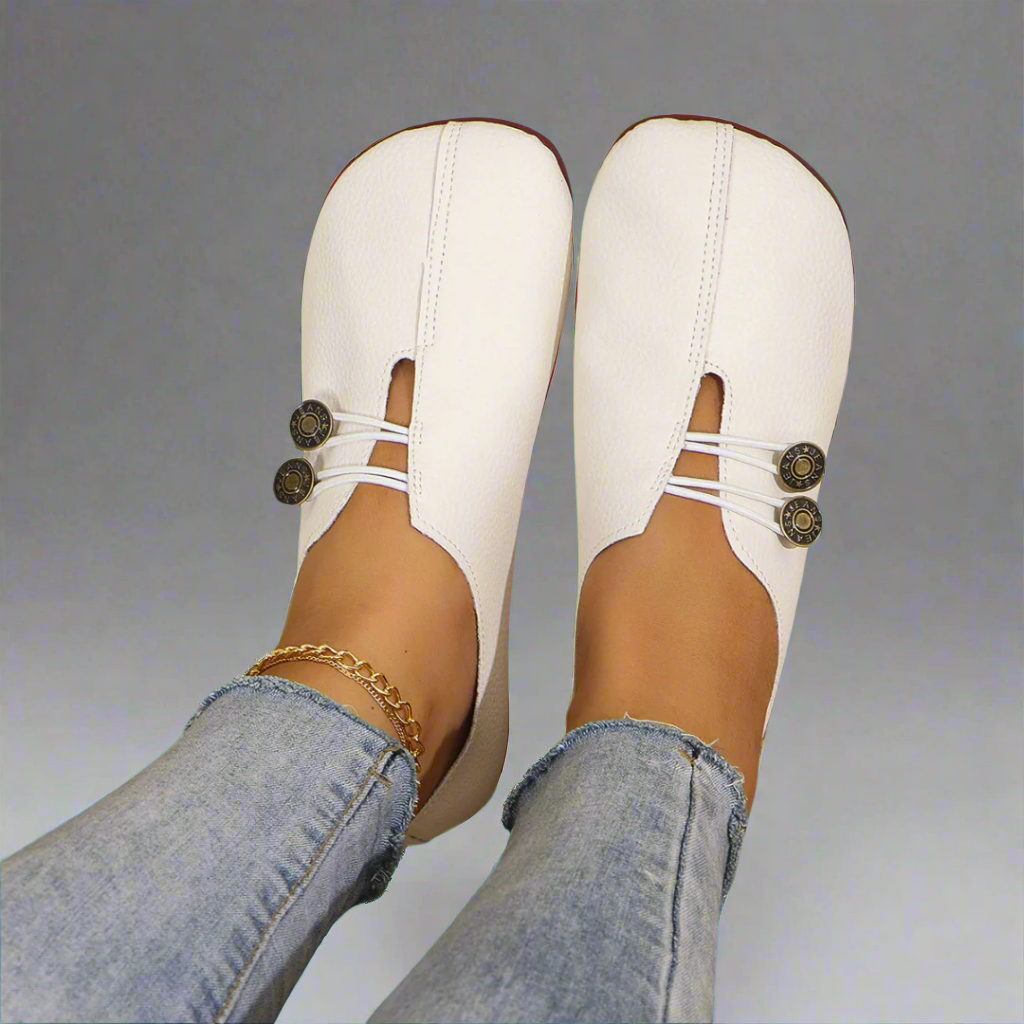 Front view of comfortable women's slip-on moccasins, showcasing the smooth upper and flat sole.