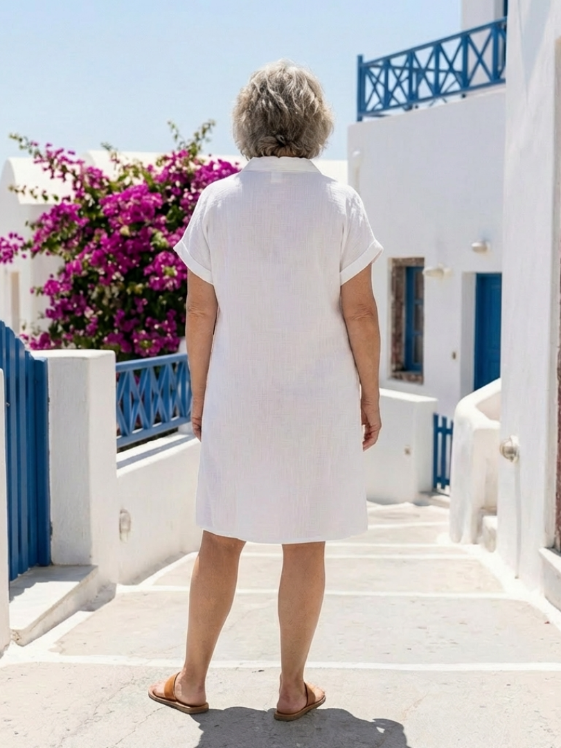Versatile women's short sleeve knee-length summer dress with pockets. Comfortable for everyday fashion.