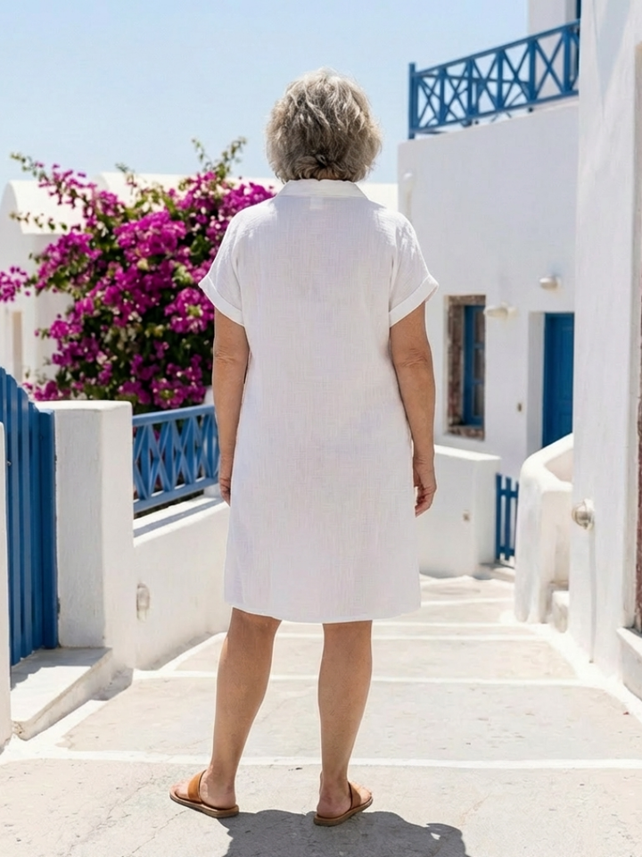 Versatile women's short sleeve knee-length summer dress with pockets. Comfortable for everyday fashion.