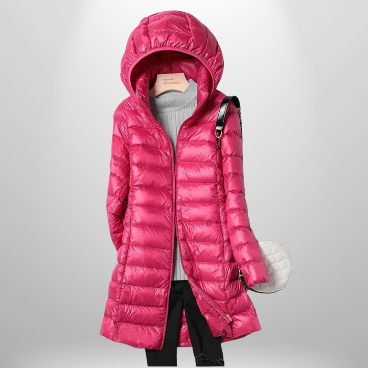 Outdoor-ready women's lightweight puffer jacket, packable & warm. Versatile outerwear for autumn/winter adventures.