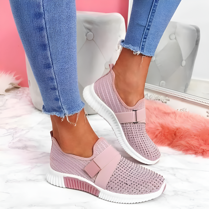 Women wearing lightweight slip-on trainers with elastic strap. Perfect comfort walking shoes for daily casual wear.
