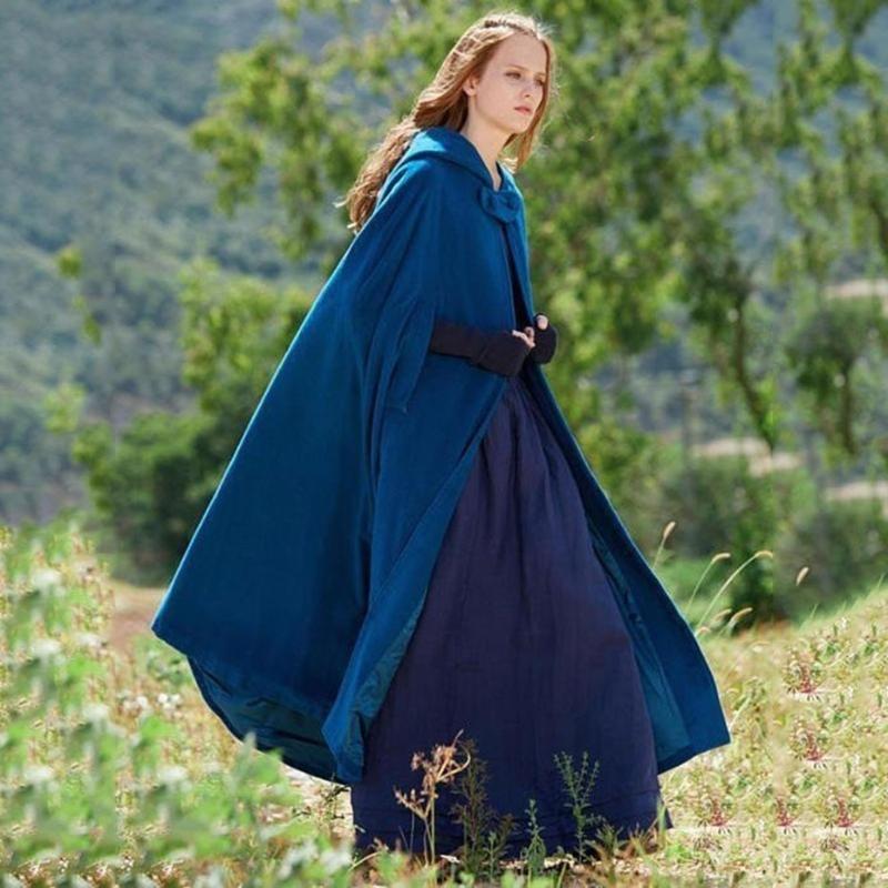 Close-up of a women's black hooded cloak with flowing, unique mystical design, perfect for elegant cosplay or winter fashion.