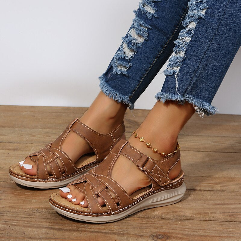 Black women's walking sandals featuring arch support, a contoured footbed, and slip-on style for ultimate comfort.