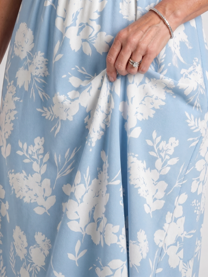 Comfortable flowy women's floral midi dress. Short sleeve V-neck design for summer casual days.