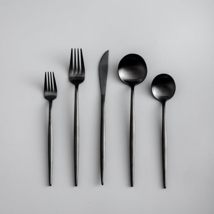 Luxury black cutlery set, modern flatware for upscale entertaining.