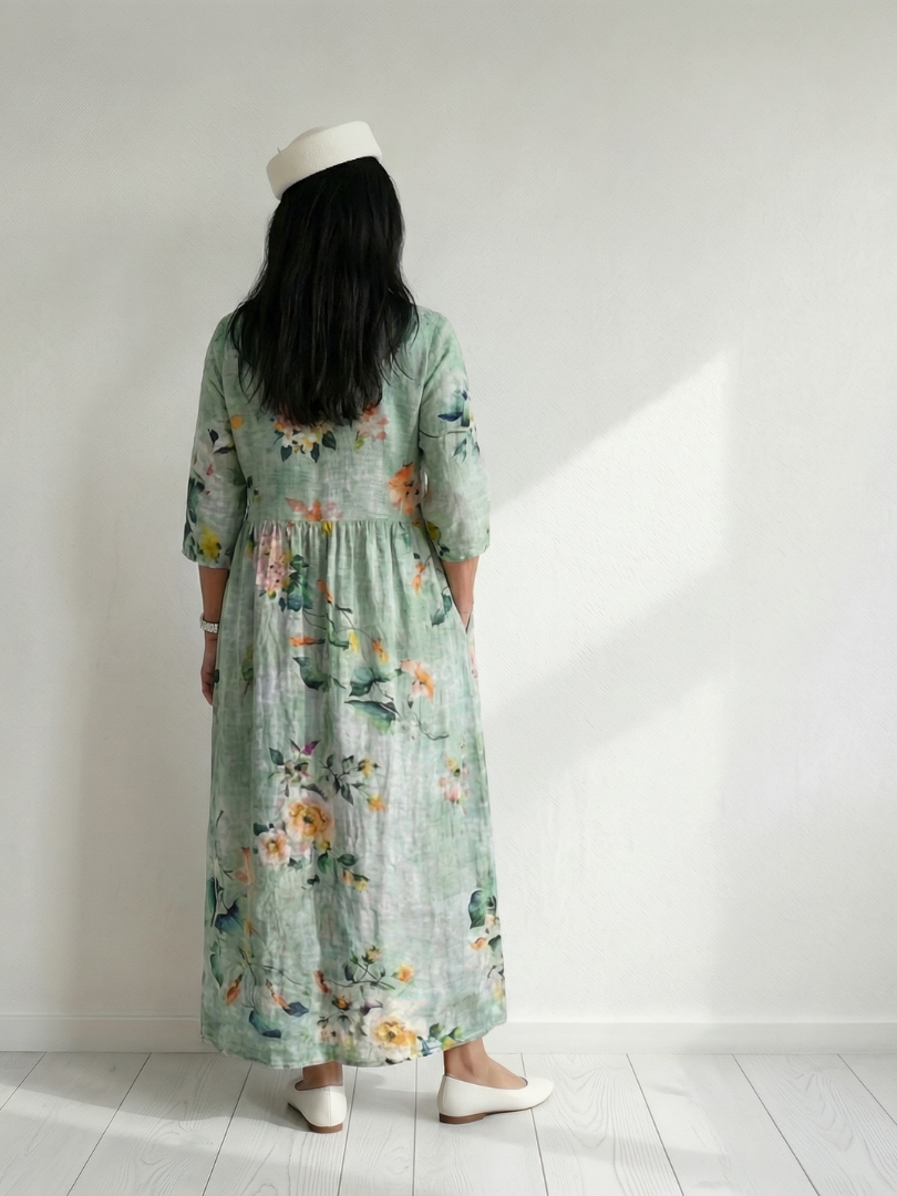 Stylish sage green floral midi dress for women, v-neck, relaxed fit, ideal for everyday wear.