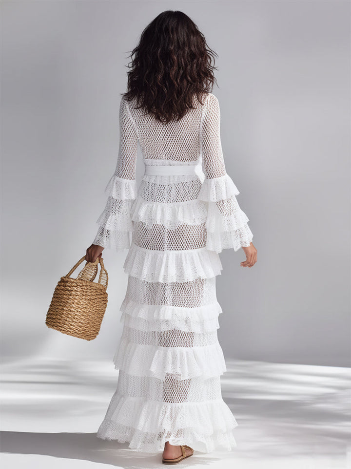 Elegant women's white crocheted knit cardigan with a stylish v-neck, long sleeves, and ruffle detailing.