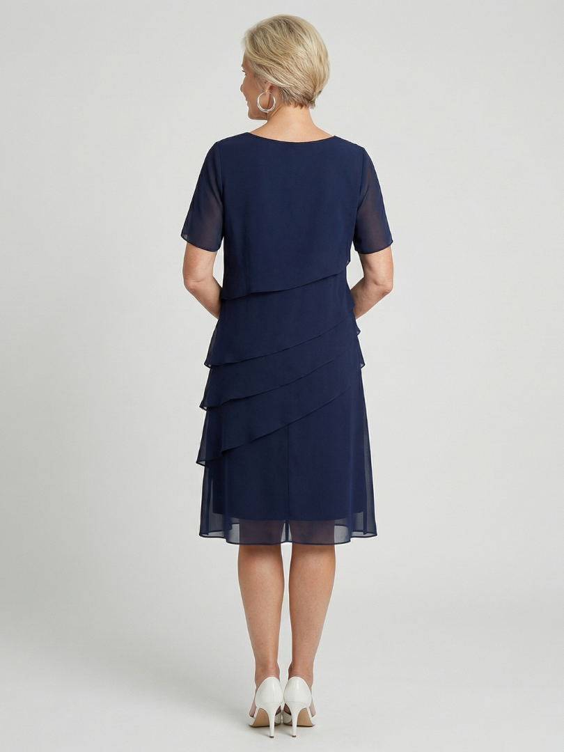 Knee-length women's dress with a relaxed fit, short sleeves, and soft contour for casual wear.