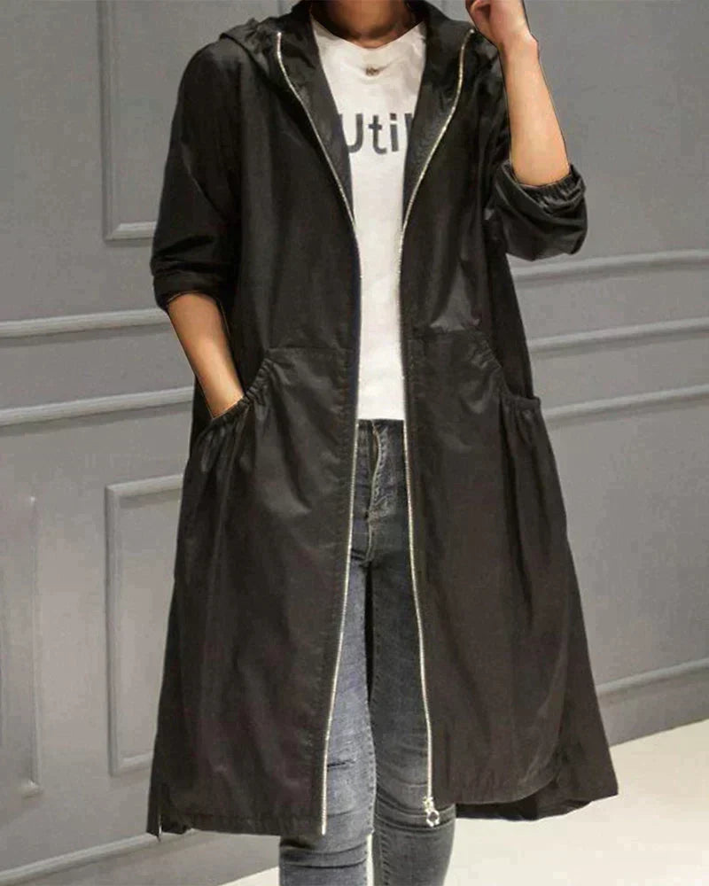 Elegant women's knee-length waterproof coat, a chic long rain jacket for optimal weather protection.