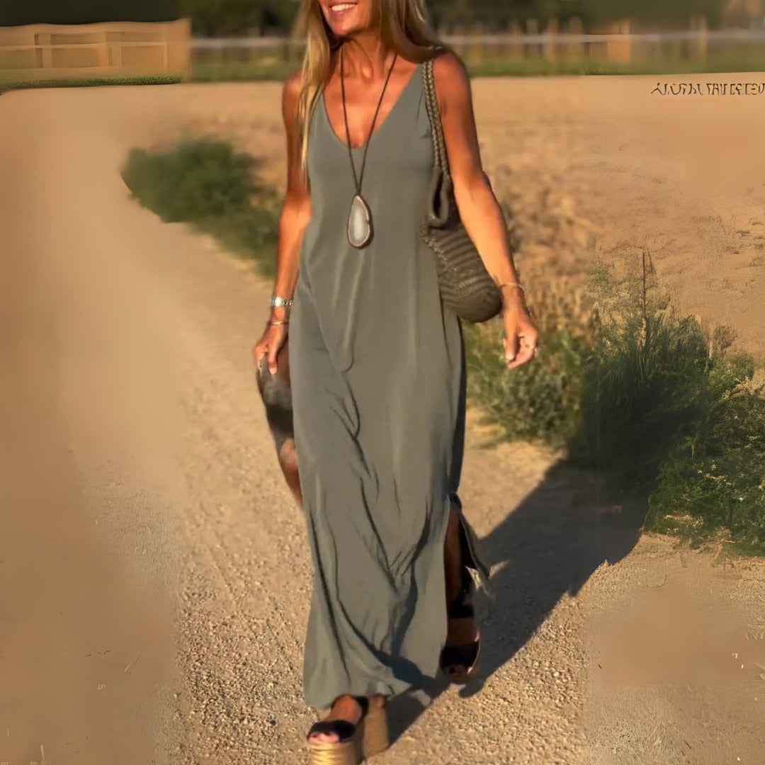 Elegant women's V-neck maxi dress, perfect for any occasion. Flowing fabric & flattering cut.