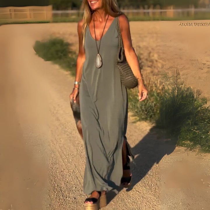 Elegant women's V-neck maxi dress, perfect for any occasion. Flowing fabric & flattering cut.