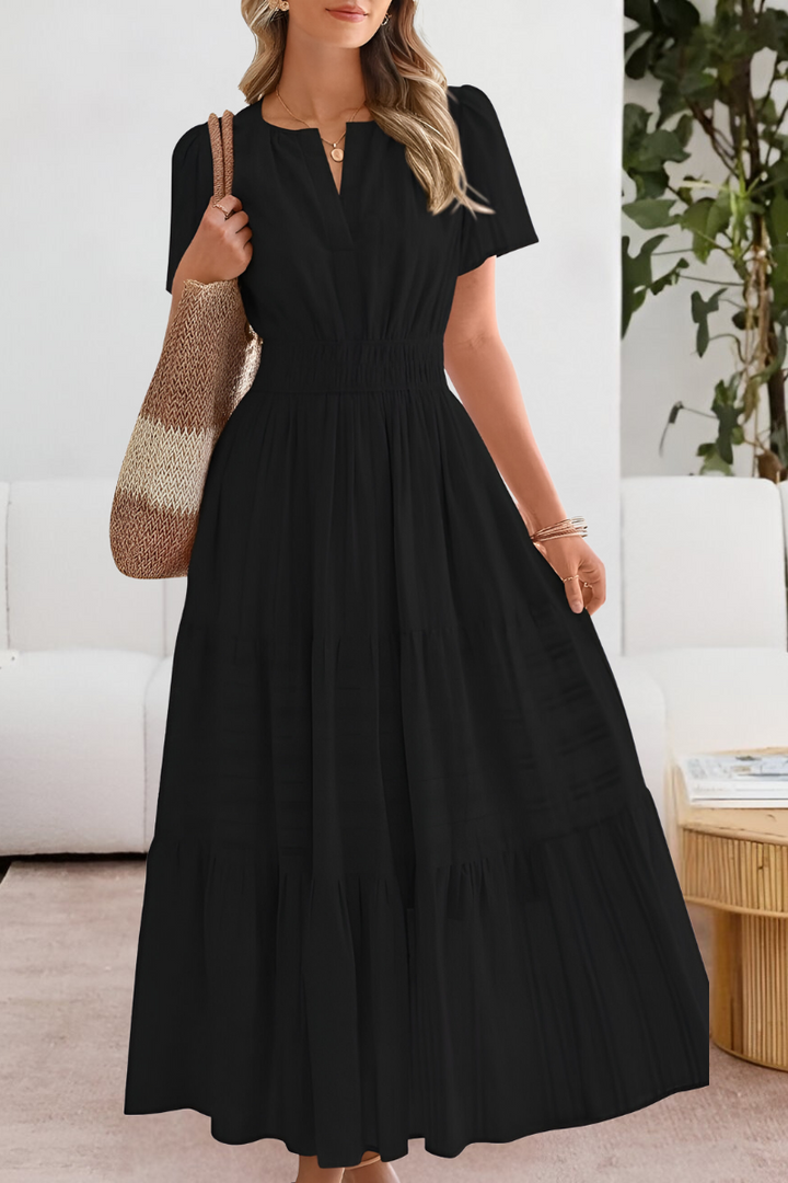 Casual women's boho midi dress with smocked bodice & short sleeves, ideal for summer style.