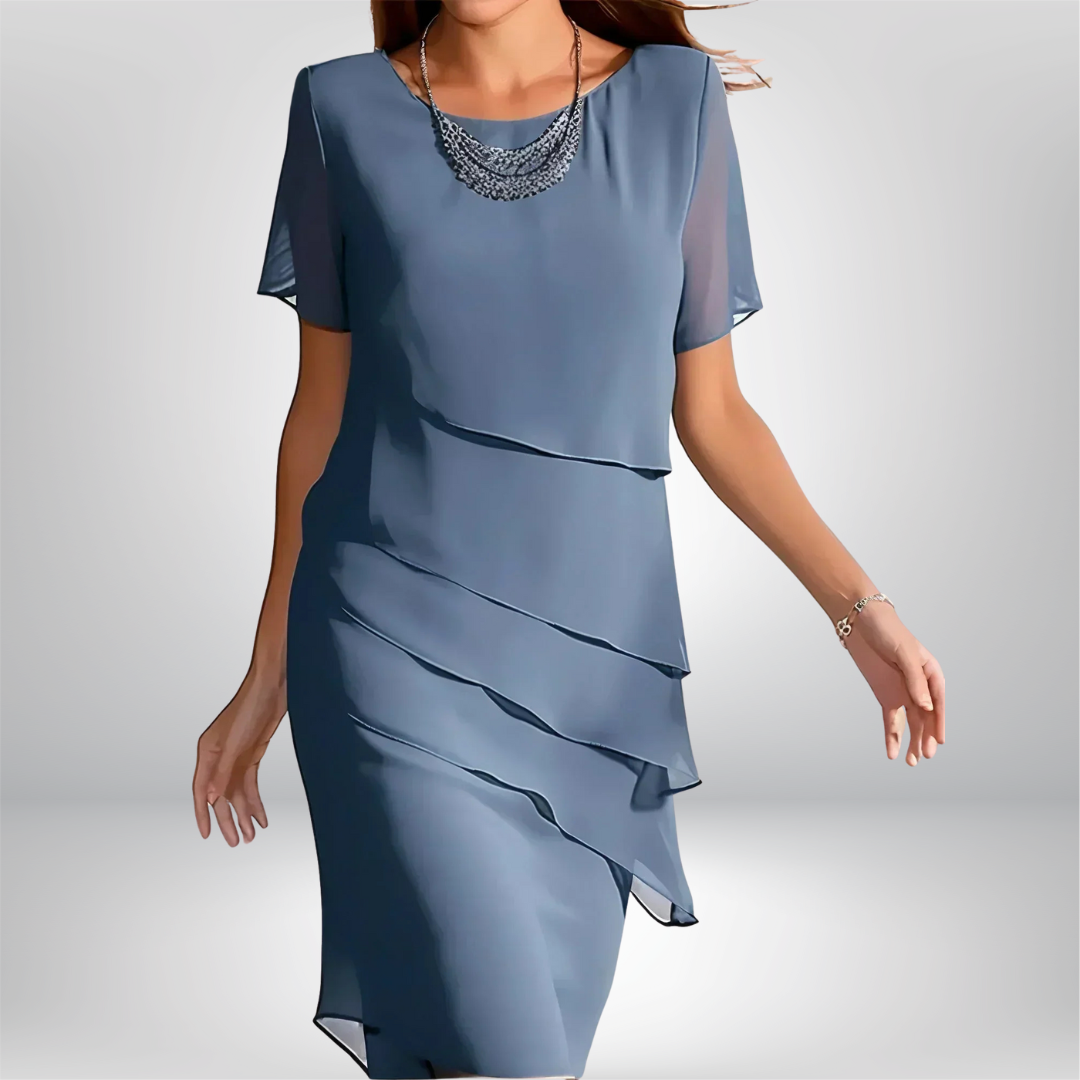 Elegant women's flowy short sleeve dress, perfect for any occasion. Comfortable and stylish daytime or evening wear.