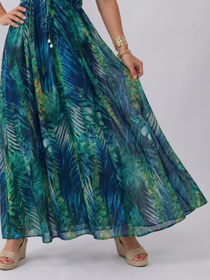 Flowy women's empire waist midi dress, sleeveless, featuring a stunning tropical pattern for elegant summer style.