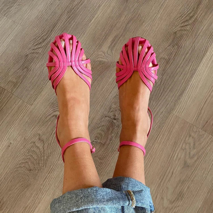 Elegant women's flat sandals, woven texture, metallic finish, designed for chic summer comfort.