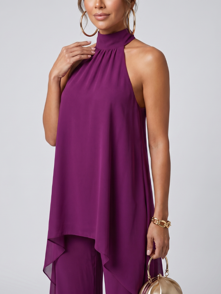 Relaxed fit women's purple asymmetric tunic with wide leg pants. Stylish two-piece coordinated summer outfit.