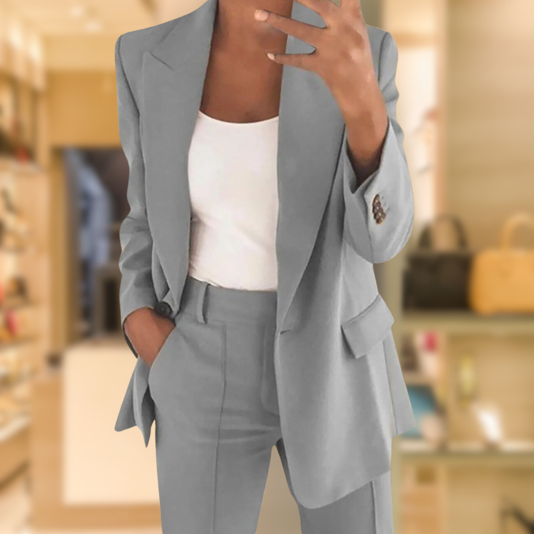 Chic women's tailored two-piece set featuring a structured blazer & elegant trousers. Versatile fashion.
