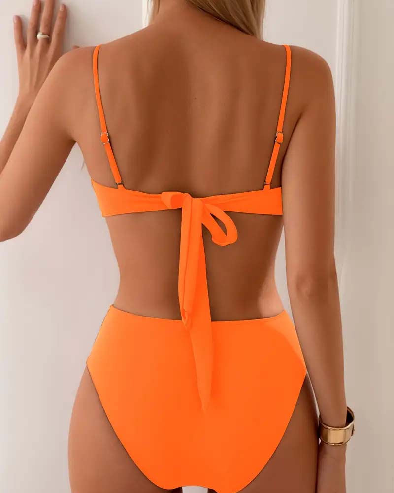 Women's elegant two-piece high-waisted bikini swimsuit with pleated details & chic gold accents.