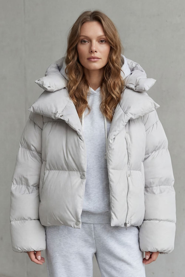 Olive green women's cropped puffer jacket, cloud-soft for warm winter casual outfits.